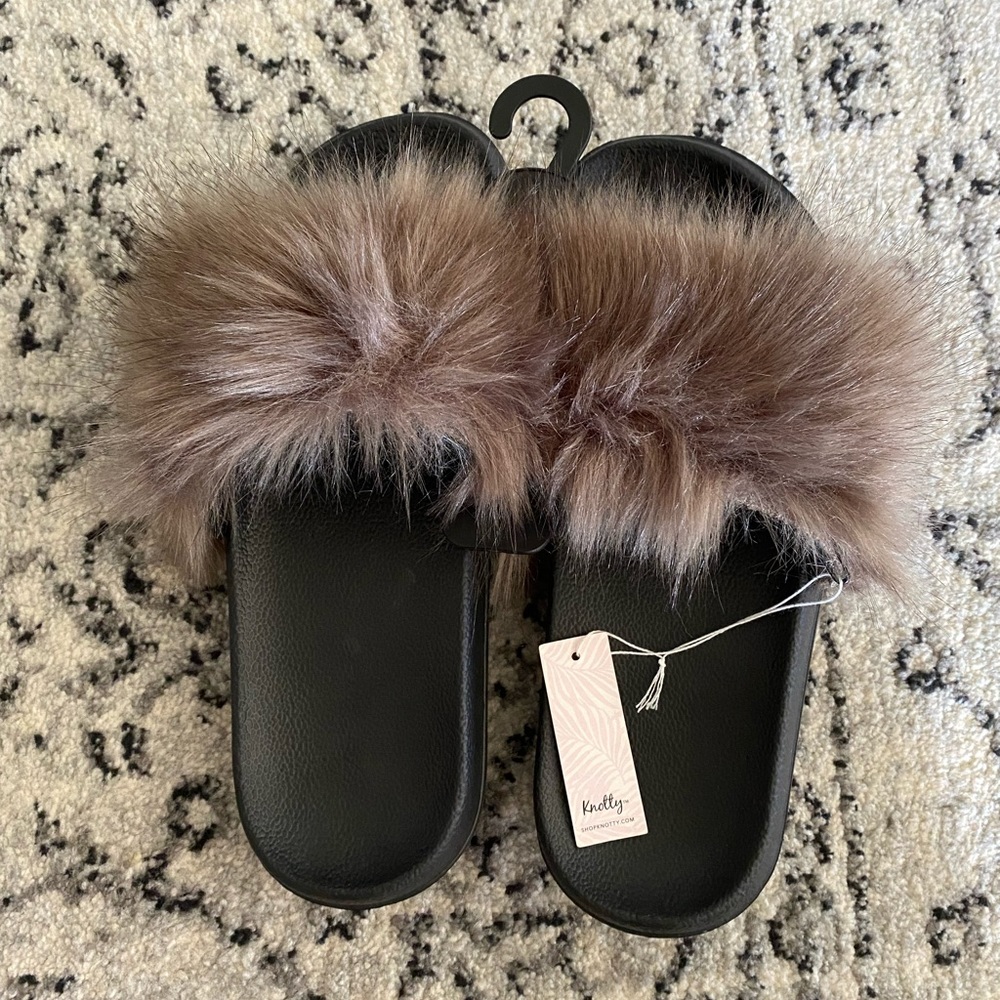 Knotty brand slide on furry sandals.